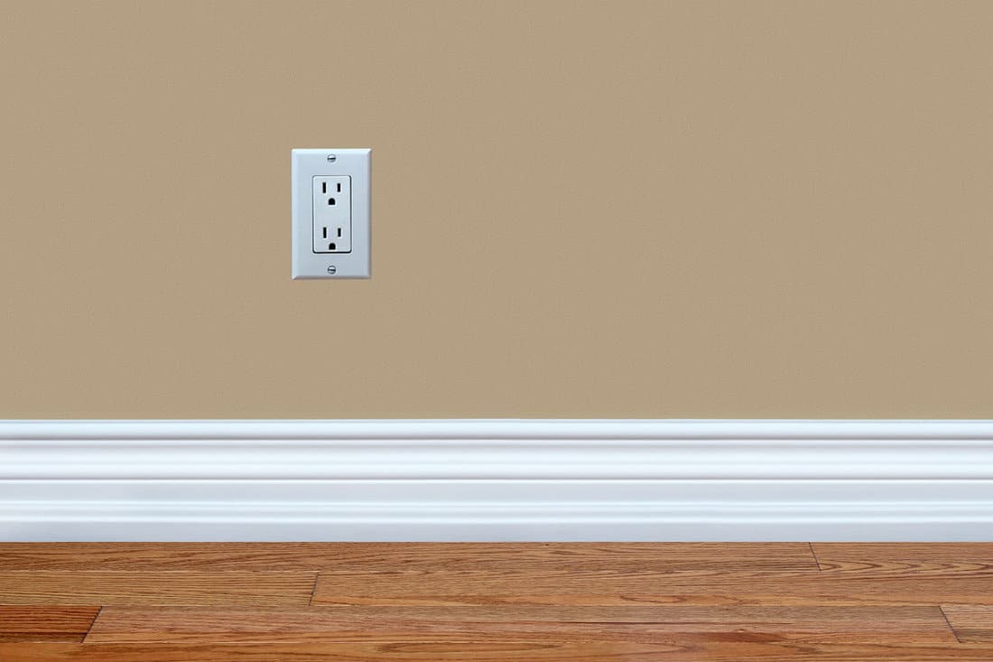 Brown wall living room with a white baseboard