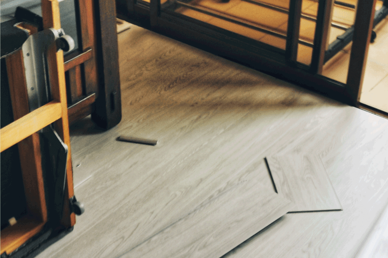 Home improvement on flooring work adding vinyl floor in living room. How To Fix Cracks In Vinyl Plank Flooring