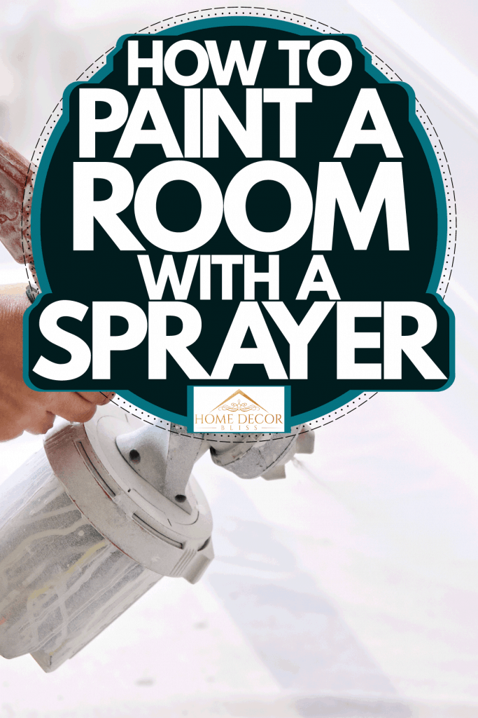 A worker using a sprayer to paint the room white, How To Paint A Room With A Sprayer