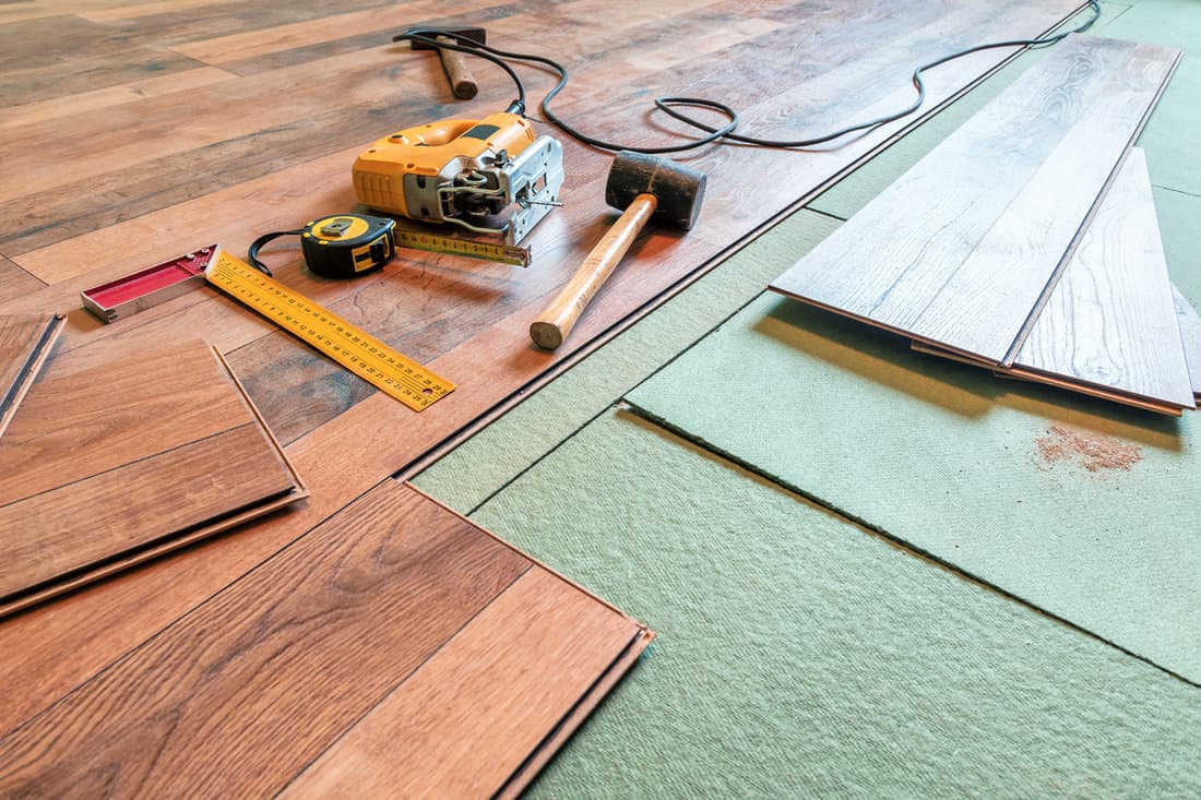 Installing hardwood flooring inside a modern living room