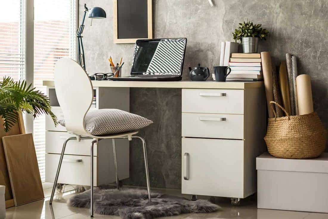 Interior of a modern home office with laptop on desk, How To Paint An Ikea Desk [10 Simple Steps]