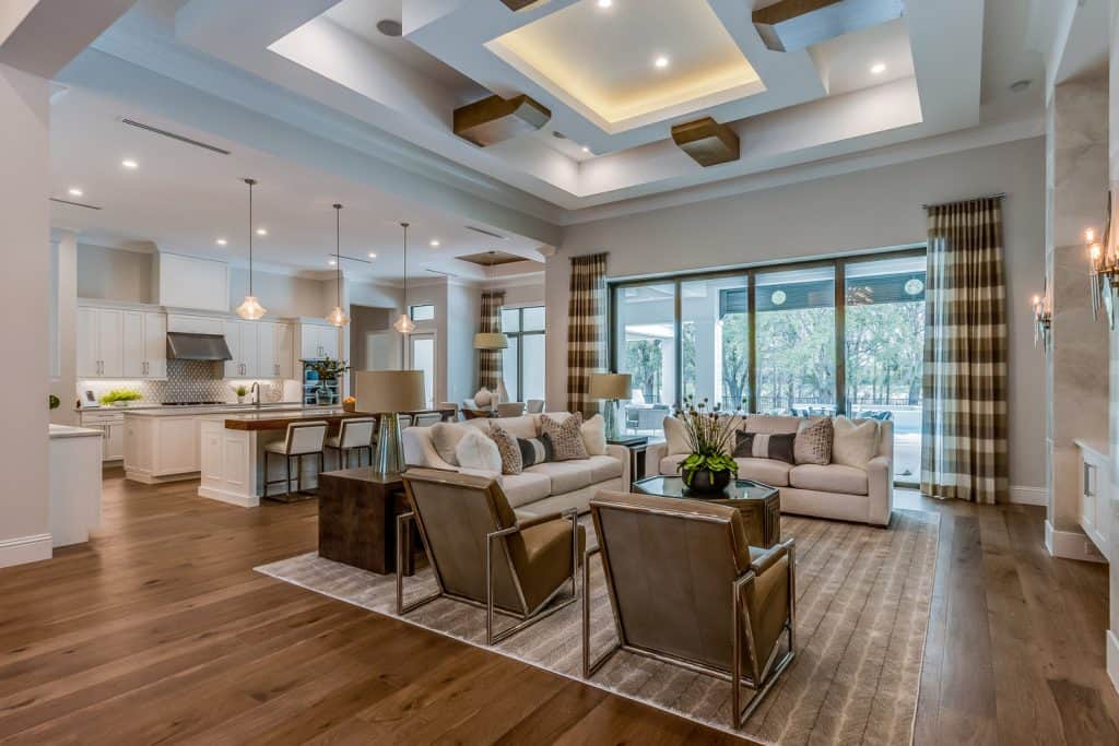 Open floor plan with high ornate coffered ceilings