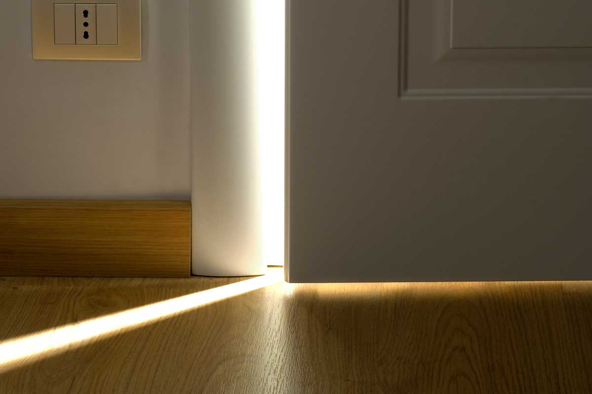 Opening white door with light behind, How To Stop Light From Coming Through Door