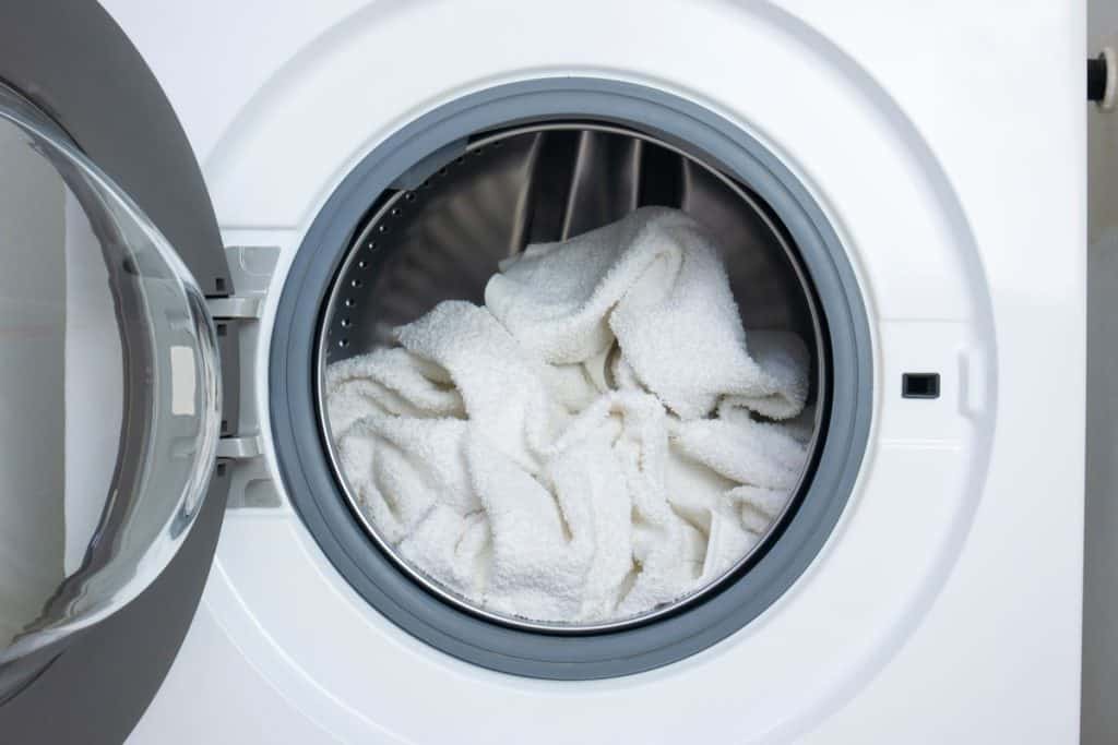 Throw white towels into the washer
