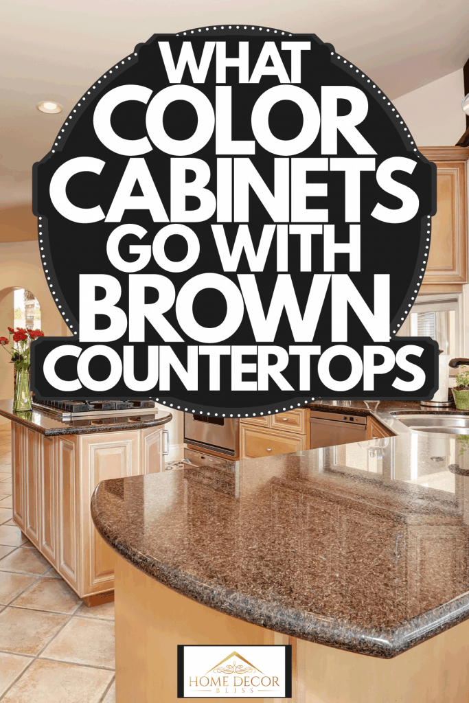 Oak cabinetries incorporated with brown marble countertops and recessed lighting, What Color Cabinets Go With Brown Countertops?