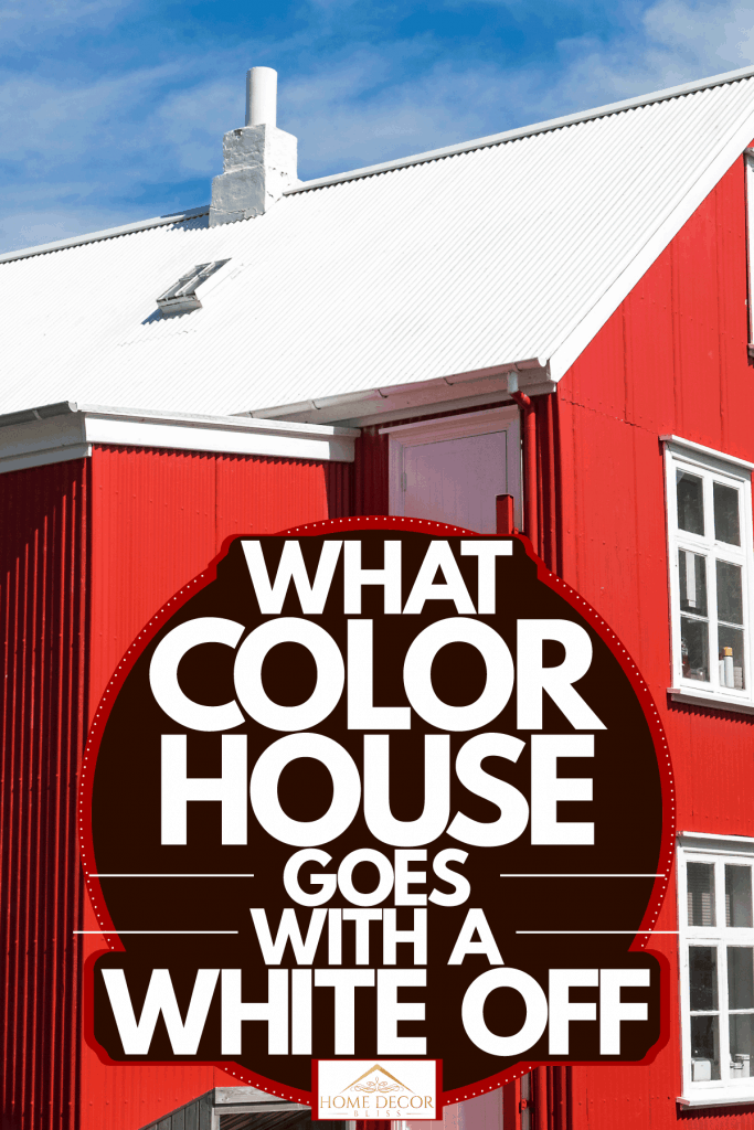 Two storey barnhouse style residential home painted in red with white window trims and white roofing, What Color House Goes With A White Roof?