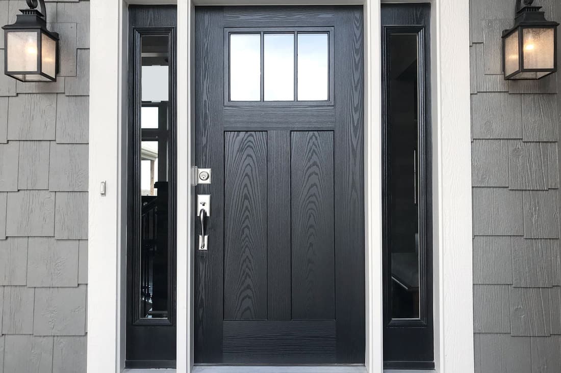 A black door with window panels on the sides, What Color To Paint Inside Of Front Door?