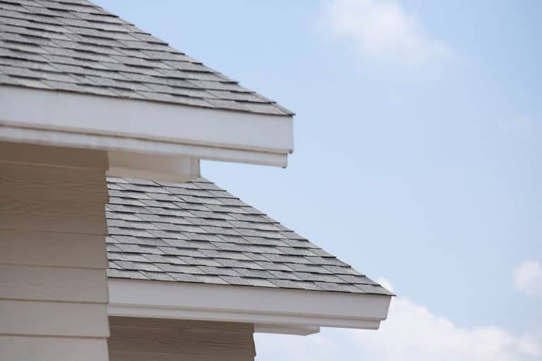 Cream colored wooden sidings and gray wooden shingles, Should House Siding Touch The Shingles?