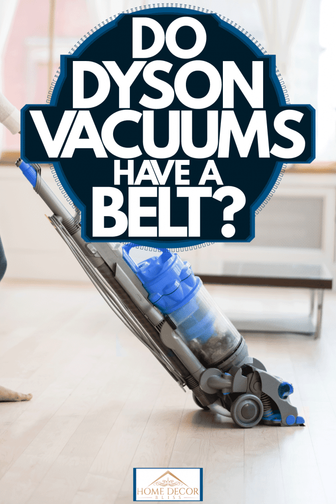 A woman using a Dyson vacuum cleaner in her living room, Do Dyson Vacuums Have A Belt?