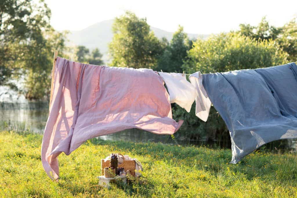 Drying bed sheets outside in the sun