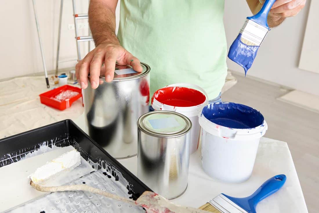 Man preparing paint, How To Paint With Benjamin Moore Advance