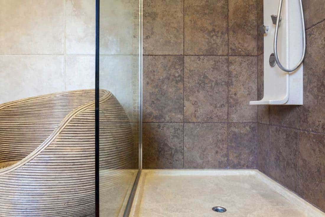Porcelain shower base in a bathroom, How Thick Should A Concrete Shower Base Be?