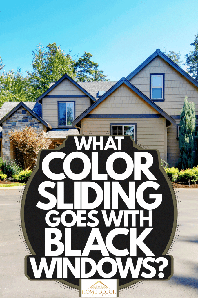 A huge two storey house with brown sidings and black windows with a huge driveway, What Color Siding Goes With Black Windows?