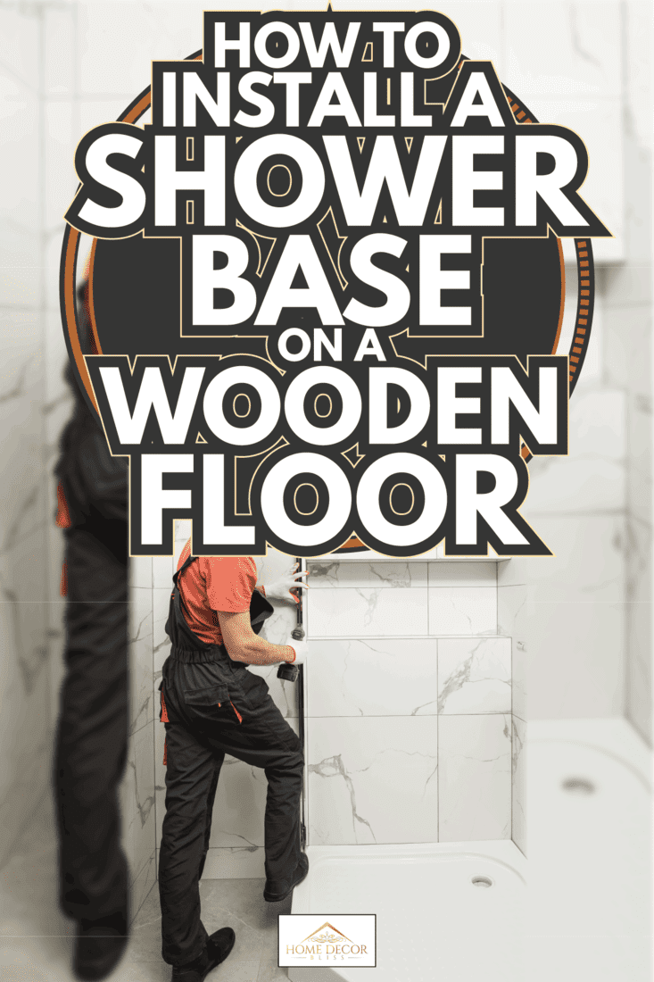 worker is installing a metal profile of the shower cabin just above the shower base. How To Install A Shower Base On A Wooden Floor