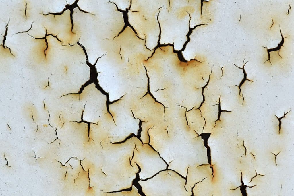 Detailed photo of a peeling white paint