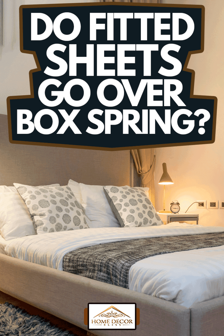 queen size bed with bed runner and reading lamp in villa, Do Fitted Sheets Go Over Box Spring?