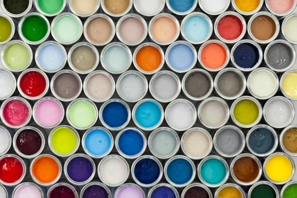 Metal cans of different colored paints