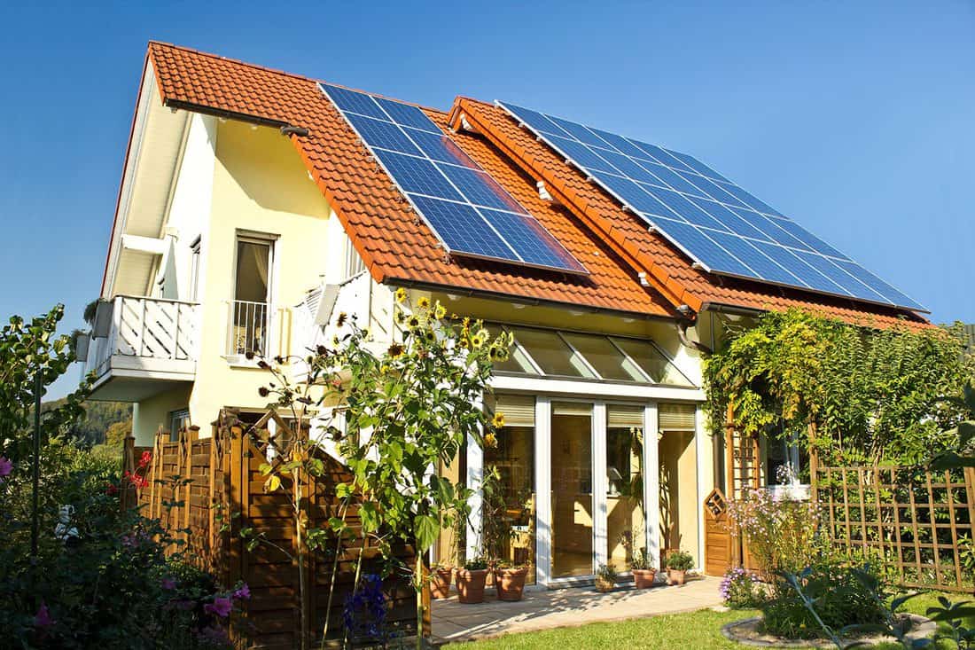 Solar panels at a house roof in late summer