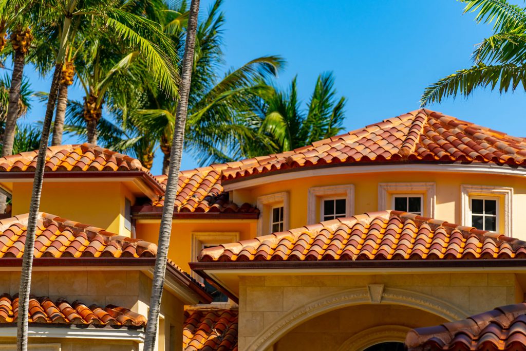 An expensive and luxurious American home with clay roofing and stucco exterior walls