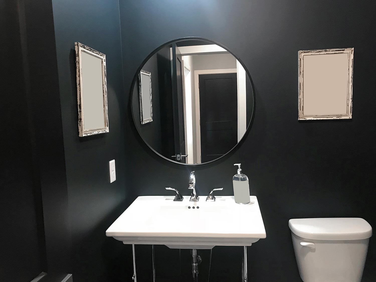 Half bathroom with black wall