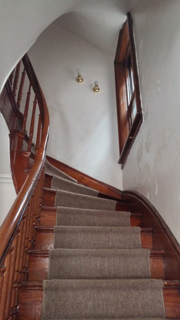 Handcrafted wooden curved staircase and handrail