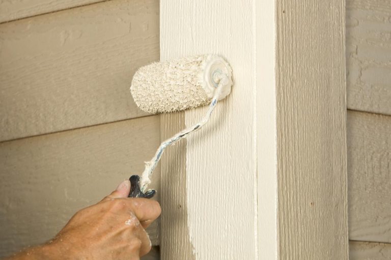 House painter rolling siding trim board, Exterior Corners – Should They Be Painted Trim Or Siding Color?