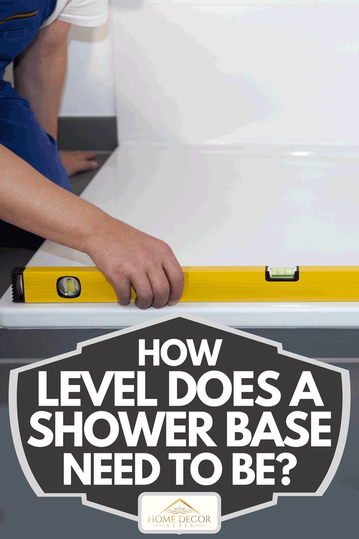 A worker using level bar on shower base, How Level Does A Shower Base Need To Be?