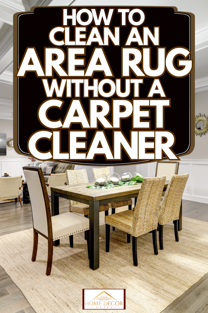 A gorgeous living room with white painted walls, wooden flooring, wicker chairs and table with an area rug, How To Clean An Area Rug Without A Carpet Cleaner