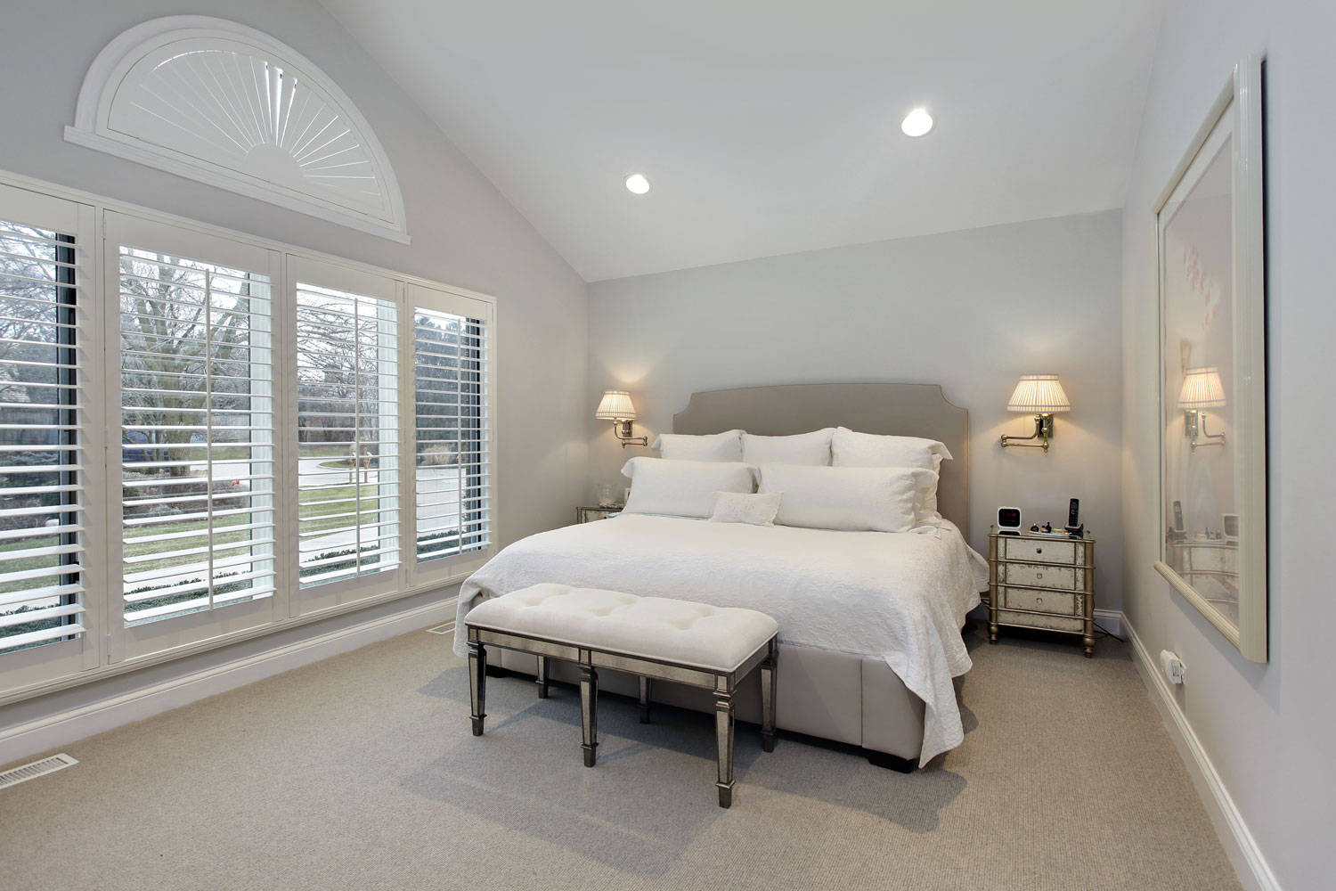 Master bedroom in suburban home with wall of windows, How Much Does It Cost To Carpet A 12X12 Room?