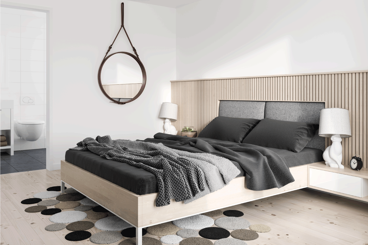 Minimalist modern bedroom. charcoal colored blankets and pillowcases