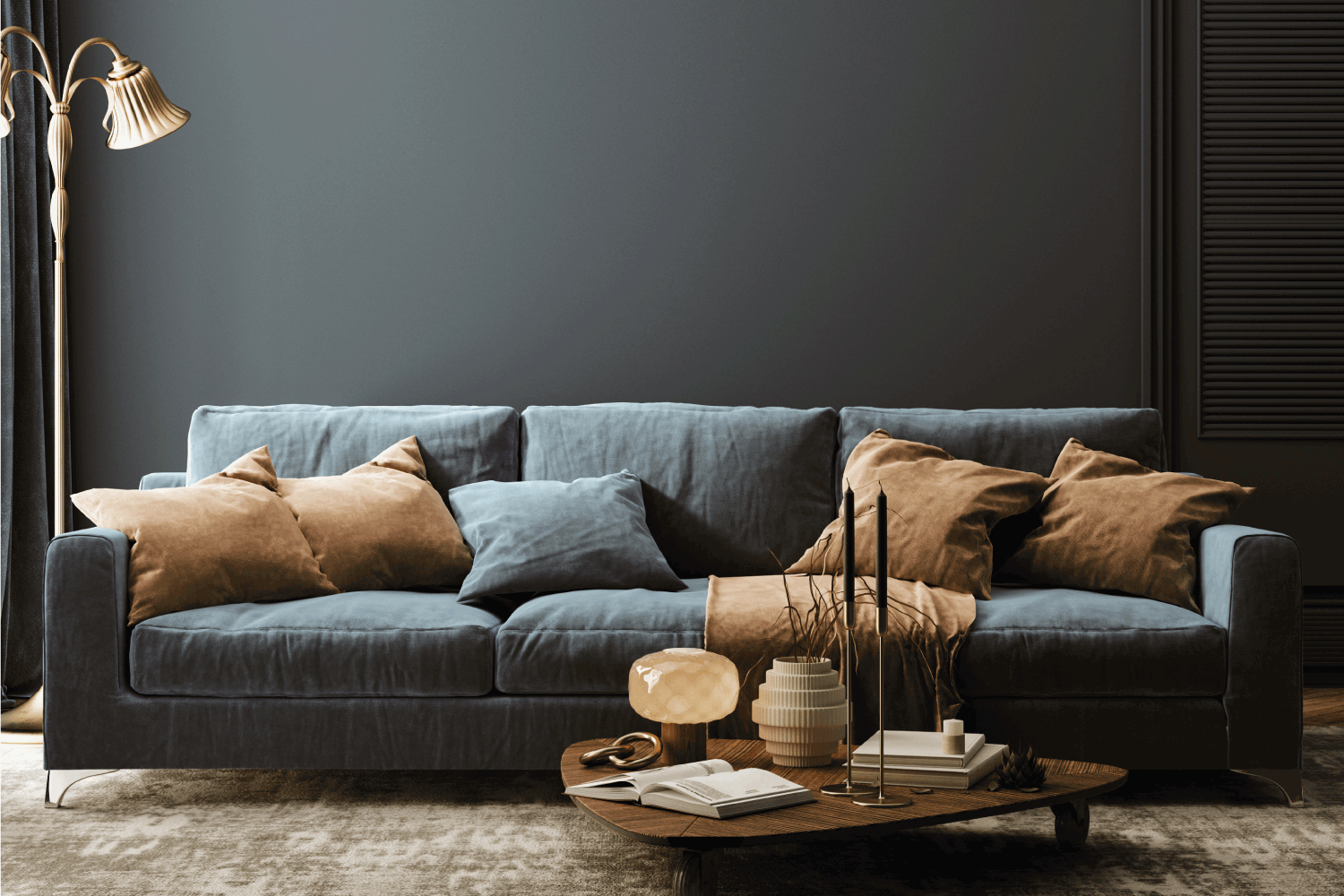 Modern home interior with dark blue sofa, table and decor in living room