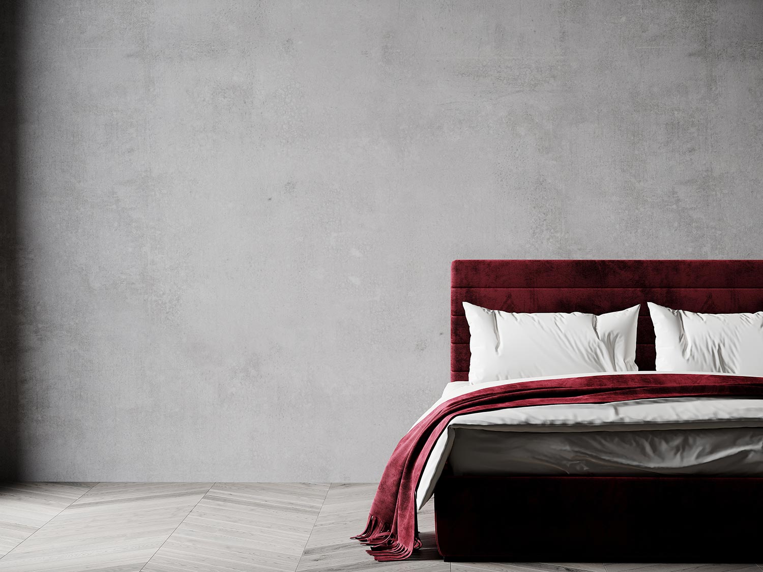 Plaster microcement and burgundy red marsala color of the bed
