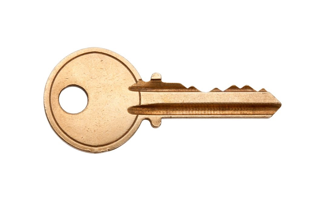 A golden key on a white background