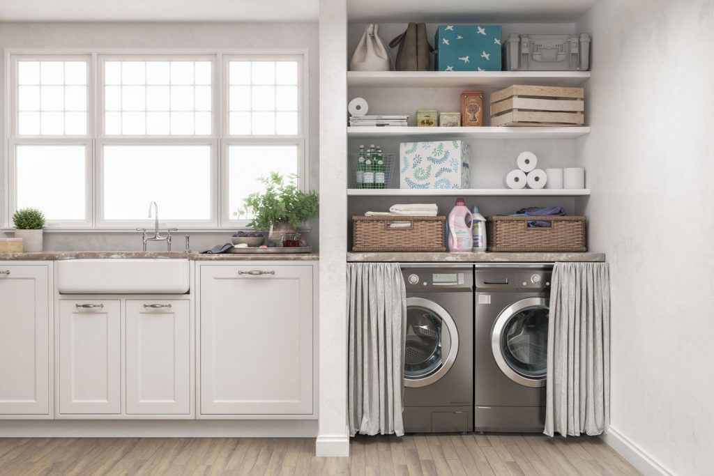 A minimalist inspired laundry room with white walls and gray washing machine and dryer