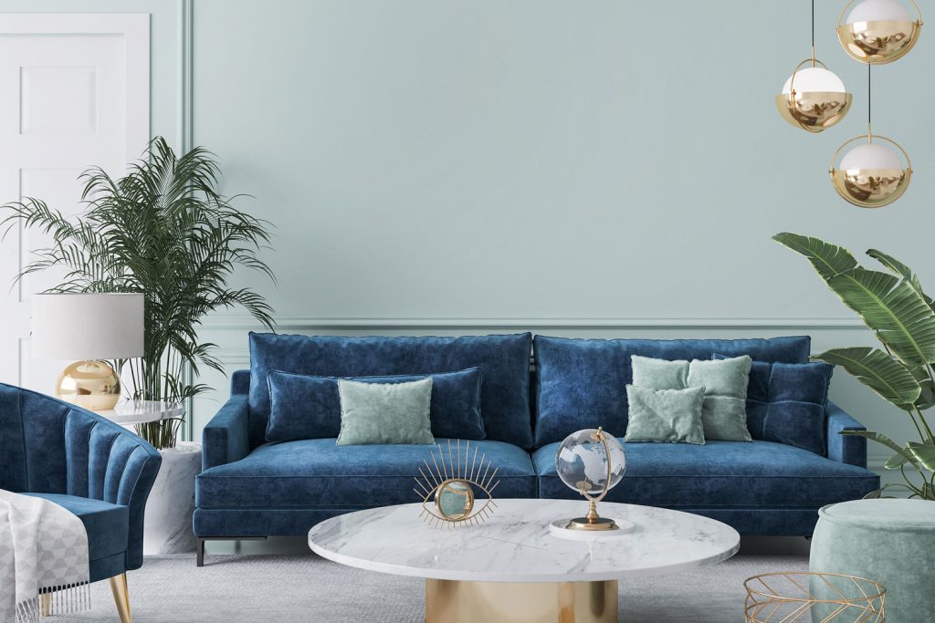 A teal and blue combination living room color themed with plants and carpeted flooring