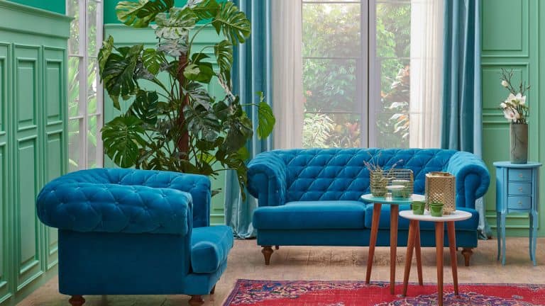 Green living room, corner, blue furniture sofa and classic wall concept, carpet vase of plant and coffee table, 11 Best Colors That Go With Gold [Home Design Combinations] - 1600x900