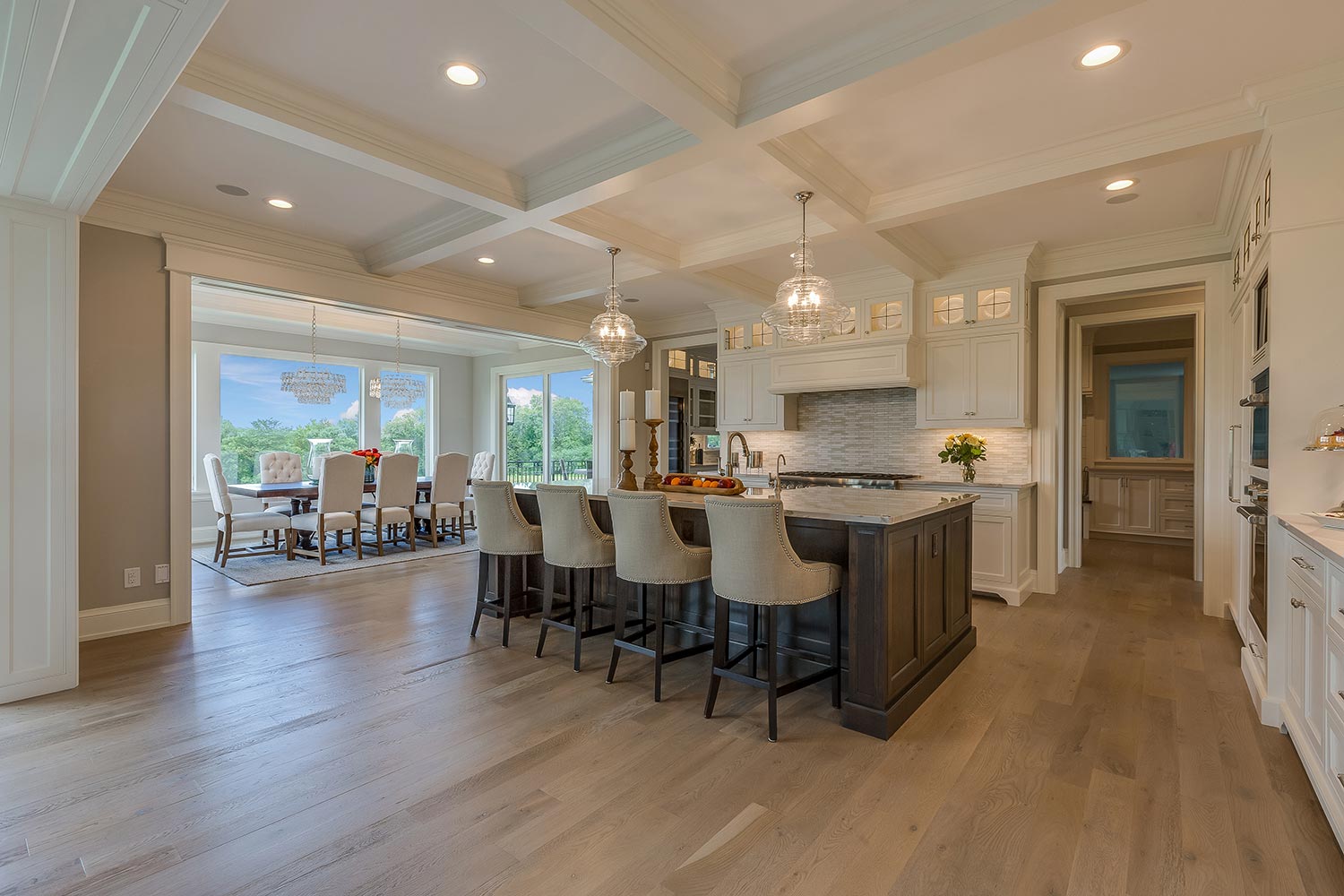 Open floor plan kitchen with coffered ceiling