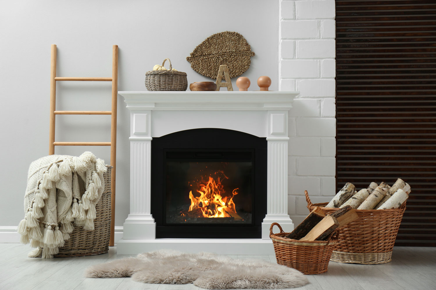 Wicker baskets with firewood and white fireplace in cozy living room, What Are The Parts Of A Fireplace?