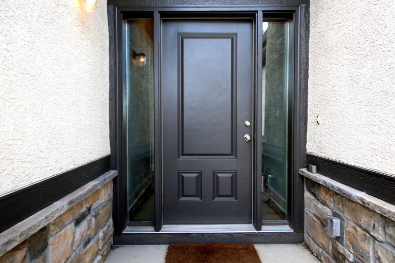 A black pivot door with glass panes on the sides, What Does A Black Front Door Mean?