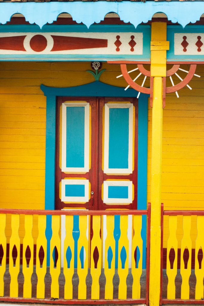 A porch with yellow walls