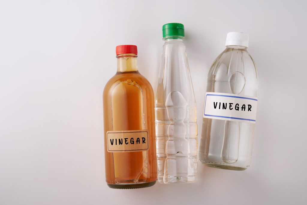 Different types of white vinegar on the table