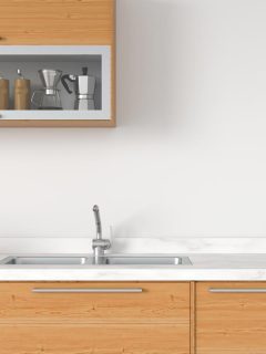 A modern white kitchen countertop with sink, How To Fill A Gap Between Countertops And Wall