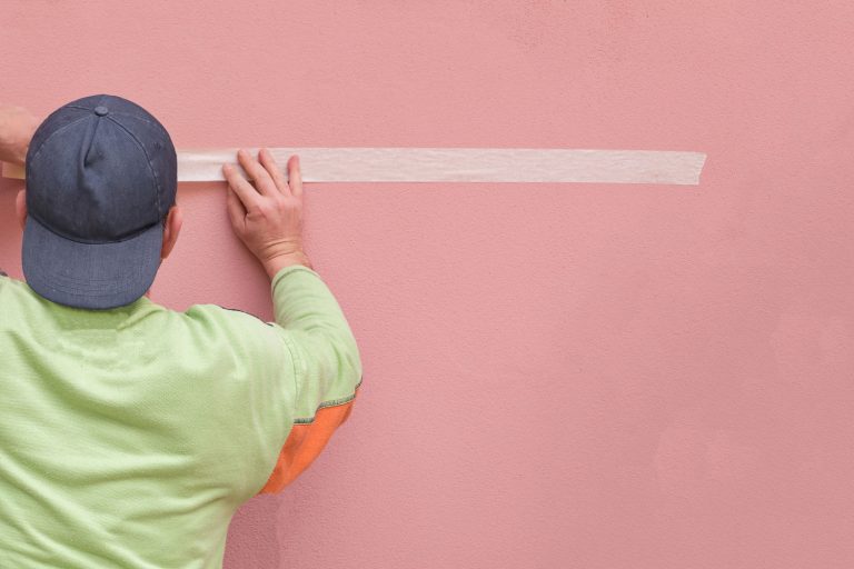 Painters tape paper preparing materials for painting pink walls, Does Mounting Tape Damage Walls?