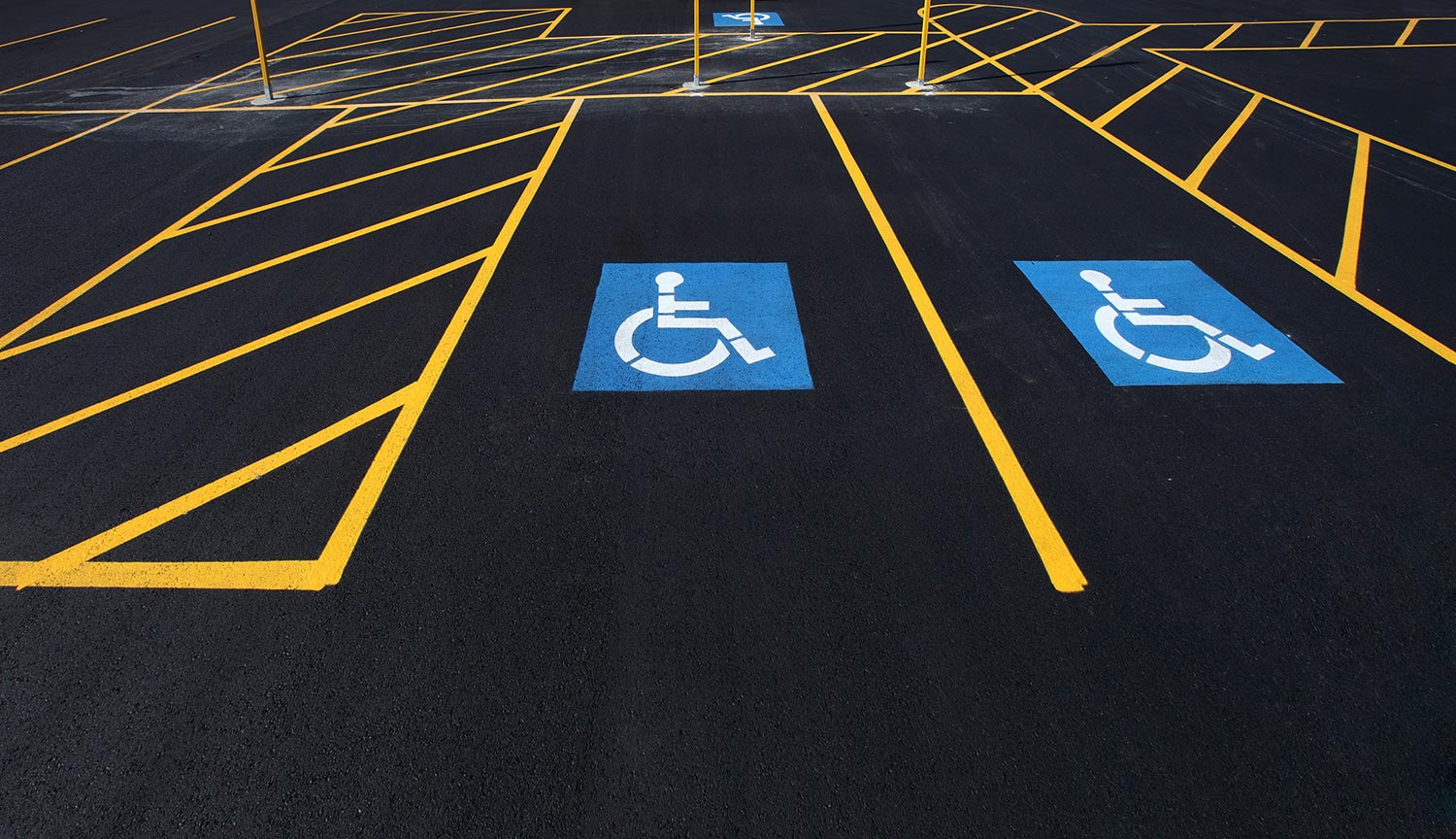 The international markings for a handicapped parking stall in a parking lot