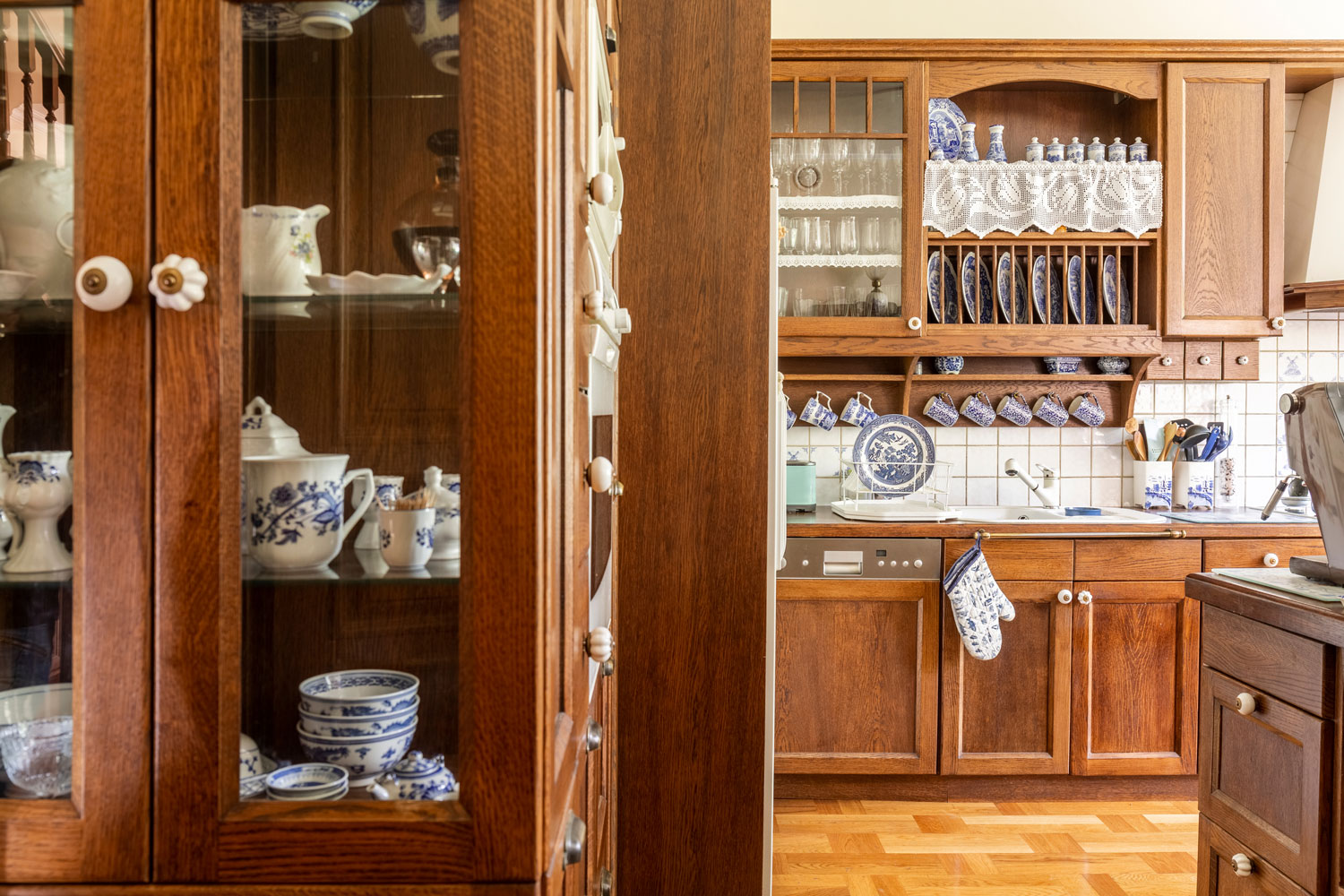 A kitchen filled with China cabinets filled with expensive Chinas