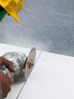 Construction worker using a sanding disk in cutting the cement board, Can Cement Board Get Wet?