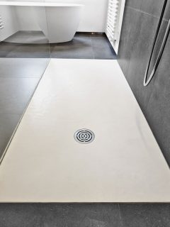 Corian floor and drain from modern shower in luxury bathroom, Can You Use Flex Seal On Shower Floor?