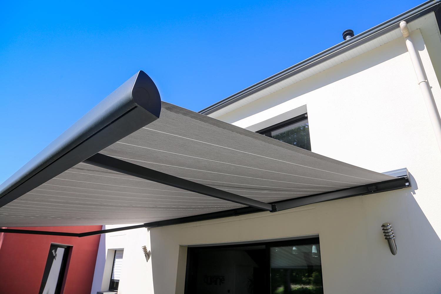 Electric aluminum modern awning on a modern house