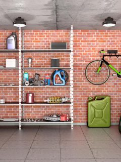 An interior garage with tools, equipment and wheels, How Thick Should Garage Walls Be?