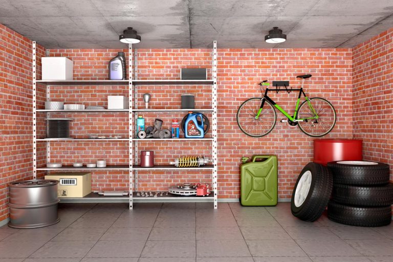 An interior garage with tools, equipment and wheels, How Thick Should Garage Walls Be?